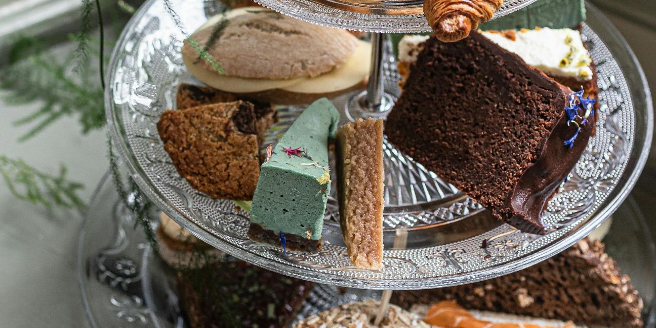 Selection of cakes and sandwiches on a cake stand - Afternoon Tea Bryn Berwyn Tresaith